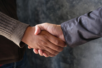 Holding hands with business partners to trust business partners, relationships to achieve future...