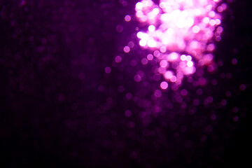 Abstract purple bokeh glitter lights defocused