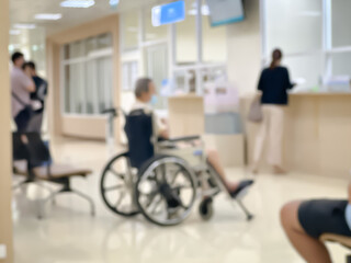 Blurred image of patients coming for check-ups in a modern hospital
