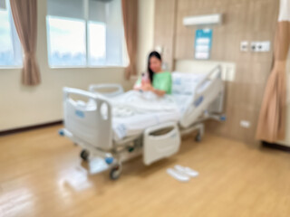 Blur image of Patients are recuperating in a luxurious, modern ward. The atmosphere is clear and you can see the surrounding view.