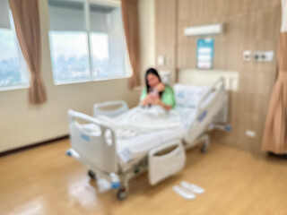 Blur image of Patients are recuperating in a luxurious, modern ward. The atmosphere is clear and you can see the surrounding view.