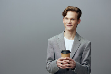 Young businessman smiling with smartphone; casual professional man; technology and communication.