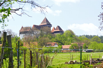 View of the fortress in the village of Viscri - a landmark of Romania, listed as a UNESCO World...