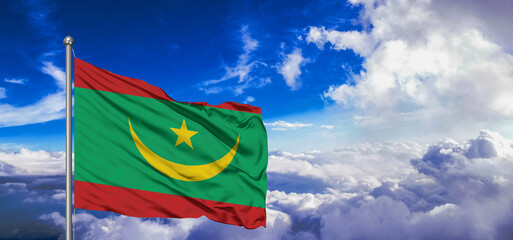 Mauritania flag cloth fabric waving on beautiful Blue Sky Background.