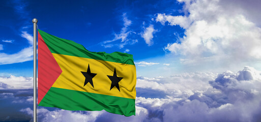 Sao Tome and Principe national flag cloth fabric waving on beautiful Blue Sky Background.