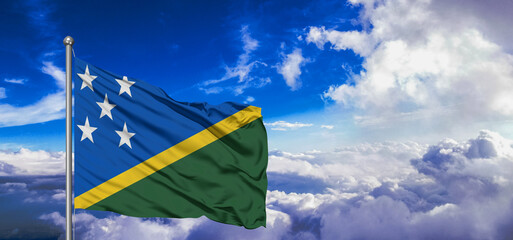 Solomon Islands national flag cloth fabric waving on beautiful Blue Sky Background.