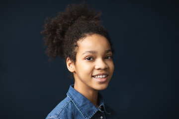 Closeup portrait of happy admiring smiling girl with afro hairstyle