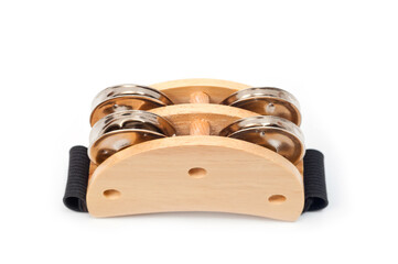 Compact tambourine with a wooden body and metal plates. Worn on the musician's leg or arm.