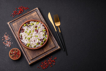Delicious white cooked rice with green edamame beans with salt and spices