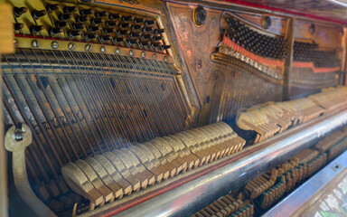 Interior of an old broken piano with defective hammers - 782014164