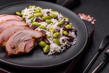 Delicious white cooked rice with green edamame beans with salt and spices