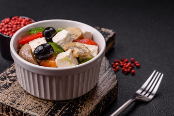 Delicious fresh juicy salad of sweet peppers, cheese, olives, tomatoes, cucumbers