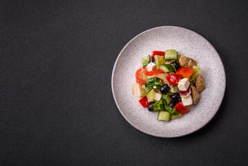 Delicious fresh juicy salad of sweet peppers, cheese, olives, tomatoes, cucumbers