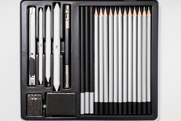 Top view of new art pencils collection and box. Accessories for drawing and art hobbies