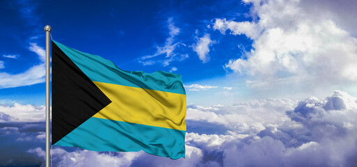 The Bahamas national flag cloth fabric waving on beautiful Blue Sky Background.