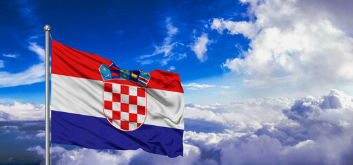 Croatia national flag cloth fabric waving on beautiful Blue Sky Background.