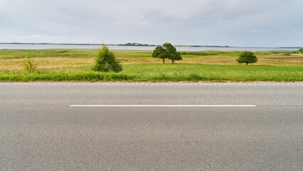 Lane marking on asphalt road in rural countryside in Sweden