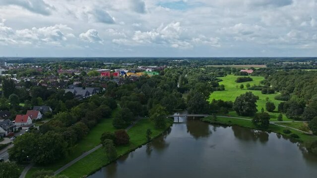 An aerial drone view of Aasee Lake in M&uuml;nster . Lake Aasee is an artificial lake located in M&uuml;nster , Germany .