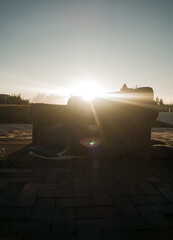 Abandoned sofa in a park in Bosa with the sun in the background in Bogotá – Colombia