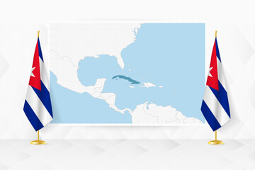 Map of Cuba and flags of Cuba on flag stand.