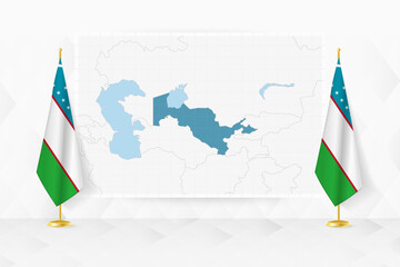 Map of Uzbekistan and flags of Uzbekistan on flag stand.