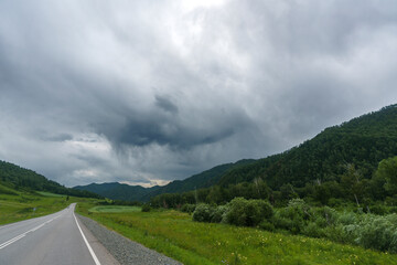 feelings of speed due to smeared roadsides and nature when driving fast on a highway with a blue sky