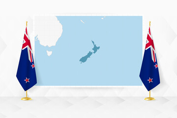 Map of New Zealand and flags of New Zealand on flag stand. - 782033160