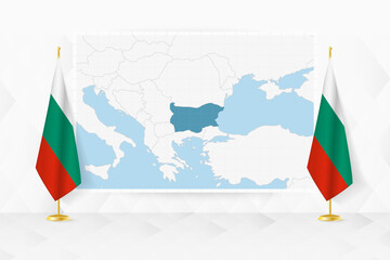 Map of Bulgaria and flags of Bulgaria on flag stand.