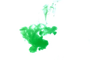 Green color dye melt on white background,Abstract smoke pattern,Colored liquid dye,Splash paint