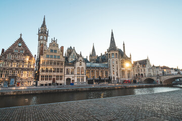 Fototapeta na wymiar Ghent promenade called the Graslei and the charming historic houses at sunrise. The centre of the Belgian city. Flanders