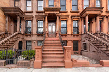 Harlem Brownstones with stoop steps in Harlem (Mount Morris Park Historic District). Row of Townhouses Manhattan, New York City - obrazy, fototapety, plakaty