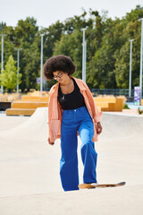 Young African American woman with curly hair executing tricks on a skateboard at a vibrant skate...