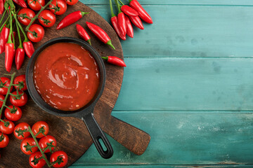 Italian tomato sauce. Homemade spicy tomato sauce or ketchup with cherry tomato and chili pepper...