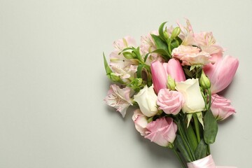 Happy Mother's Day. Bouquet of beautiful flowers on light grey background, top view. Space for text