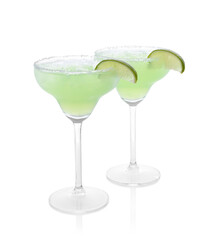 Delicious Margarita cocktail in glasses, salt and lime isolated on white