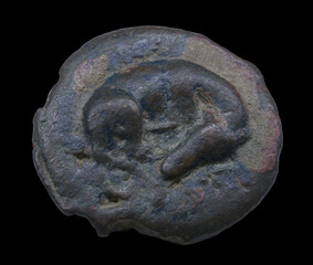 Early ancient roman coin with sleeping dog