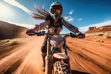 Fotobehang A female riding a motorcycle running wild with landscape of American’s Wild West with desert sandstones. © rabbit75_fot