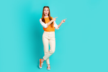 Full length photo of impressed surprised cute girl wear trendy clothes demonstrates empty space...