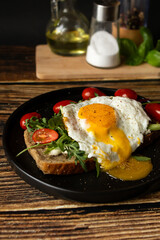 Sandwich with egg. on a wooden background. breakfast