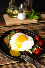 Sandwich with egg. on a wooden background. breakfast