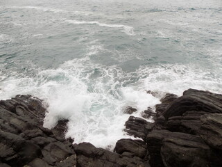 waves crashing on rocks