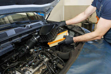 Maintaining car care service by checking cleaning and replacing car air filters