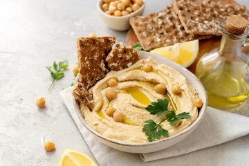Traditional hummus with chickpea olive oil and lemon with  crackers