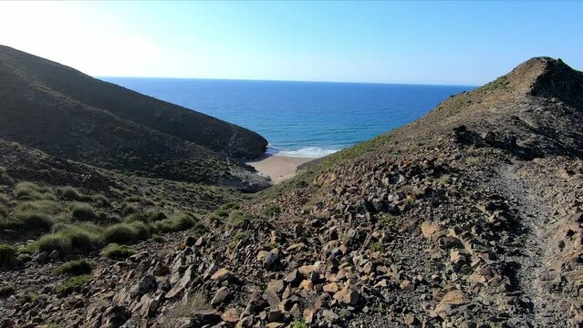 Aerial view from mountain of Cala Principe beach in the coastline of Cabo de Gata, in Nijar, Almeria, Andalusia, Spain
