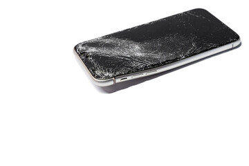 Broken cracked curved phone smartphone closeup isolated on white background with shadow, side view from button side. On the phone smartphone sat on and broke.