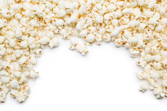 Flat lay composition with popcorn border and copy space on white background.