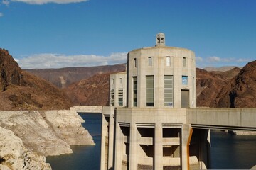 The majestic hydroelectric dam stands tall, harnessing the power of rushing waters to generate...
