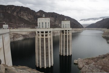 The majestic hydroelectric dam stands tall, harnessing the force of rushing waters to generate...