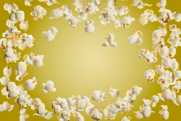 Popcorn frame with copy space, flying popcorn isolated on yellow background.