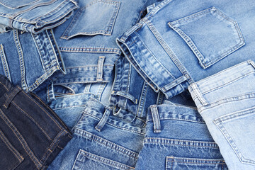beautiful fashion jeans Stacked in layers at the jeans store